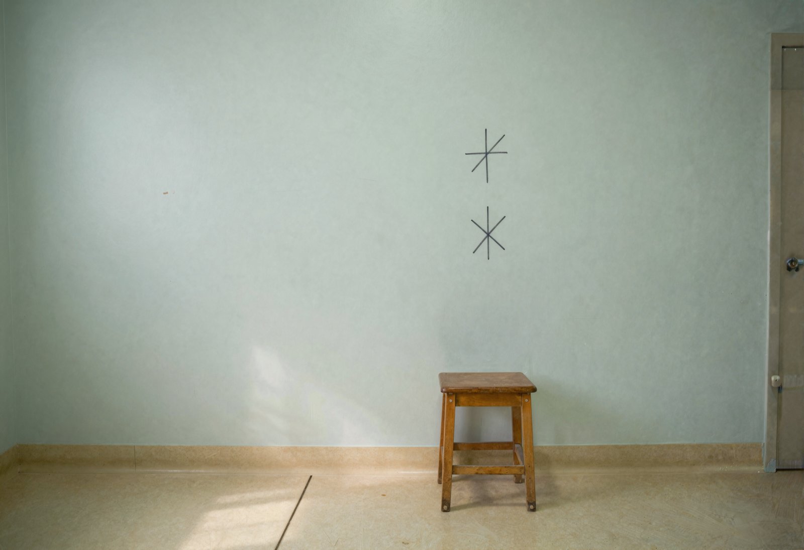 Fig. 1 — Subject 344's station, ten years on the left. The Bureau marks the wall at each ear in turn, then removes the subject. Neither mark is where the subject believes it is.